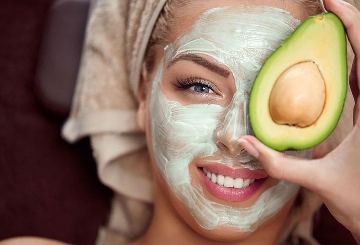young-woman-applying-avocado-face-mask-1